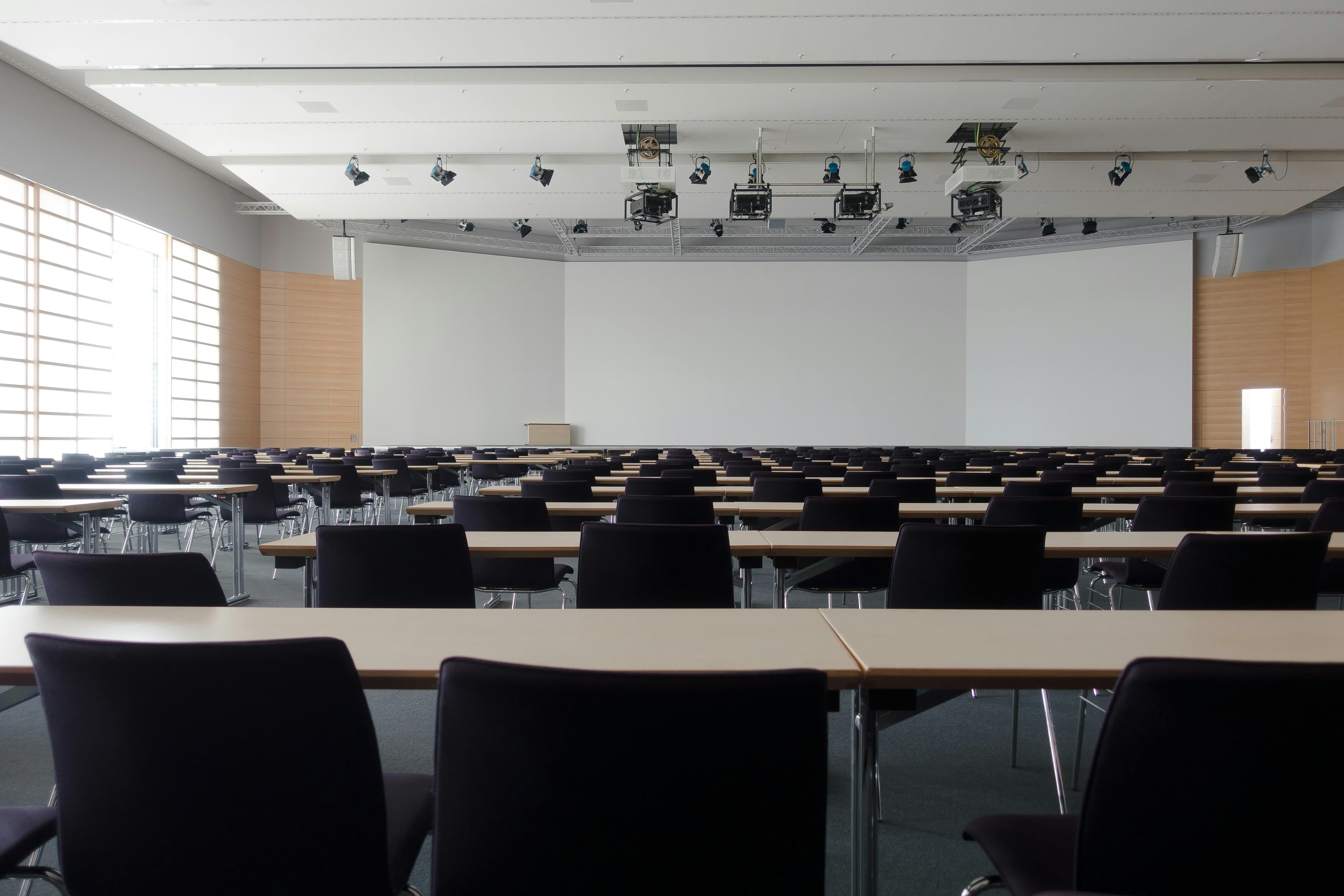 Large conference room with professional projectors and lighting equipment