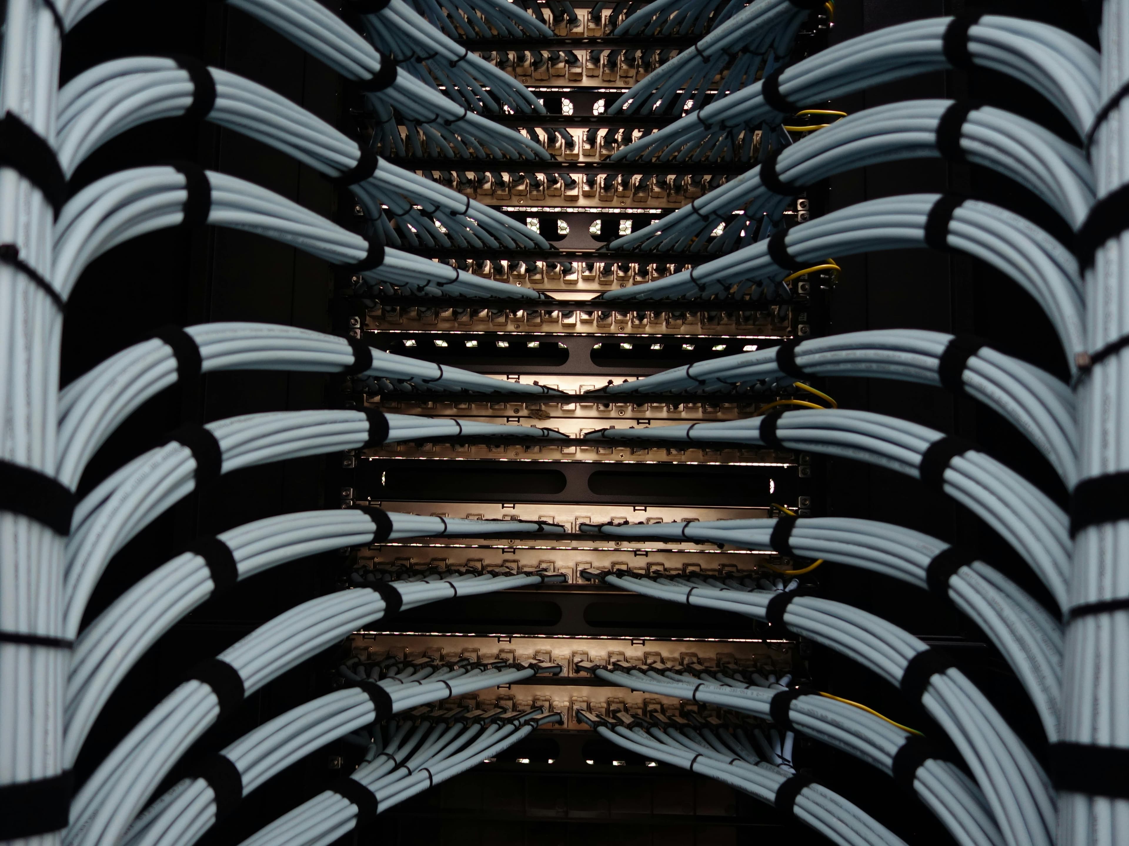 Professional structured cabling installation with organized patch panels and cable management